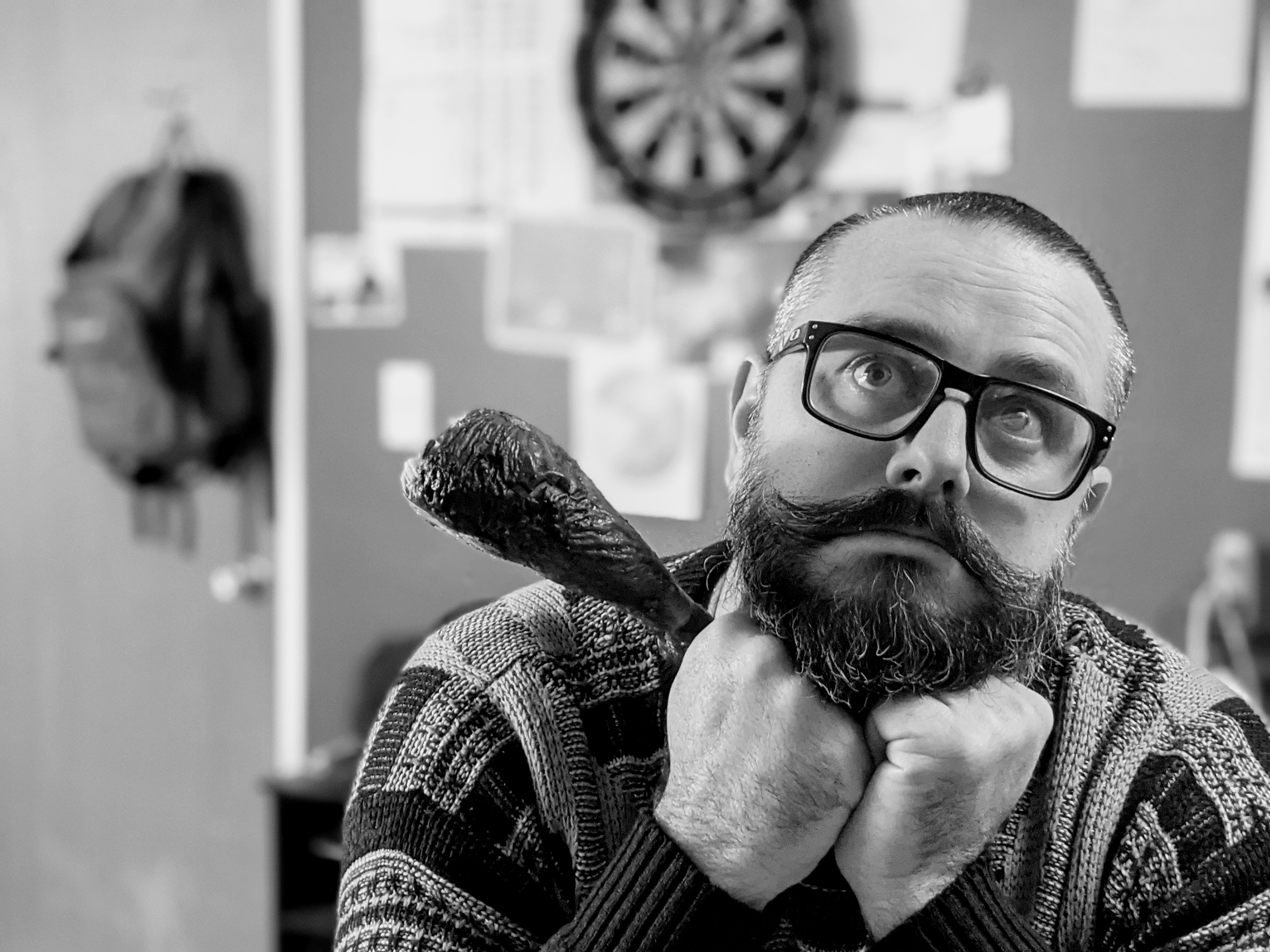 S.A. Moss in a sweater posing with a turkey leg
